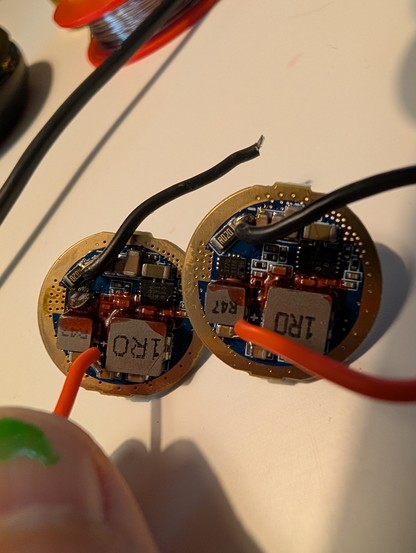 Backside of the broken and new driver side by side. The broken driver has a burnt component.